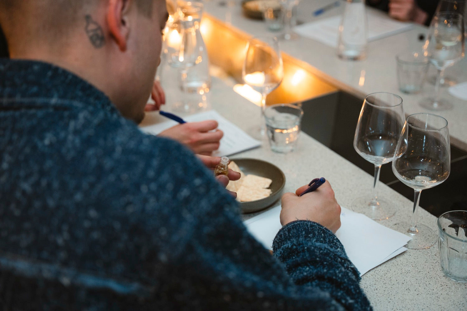 A guest taking tasting notes