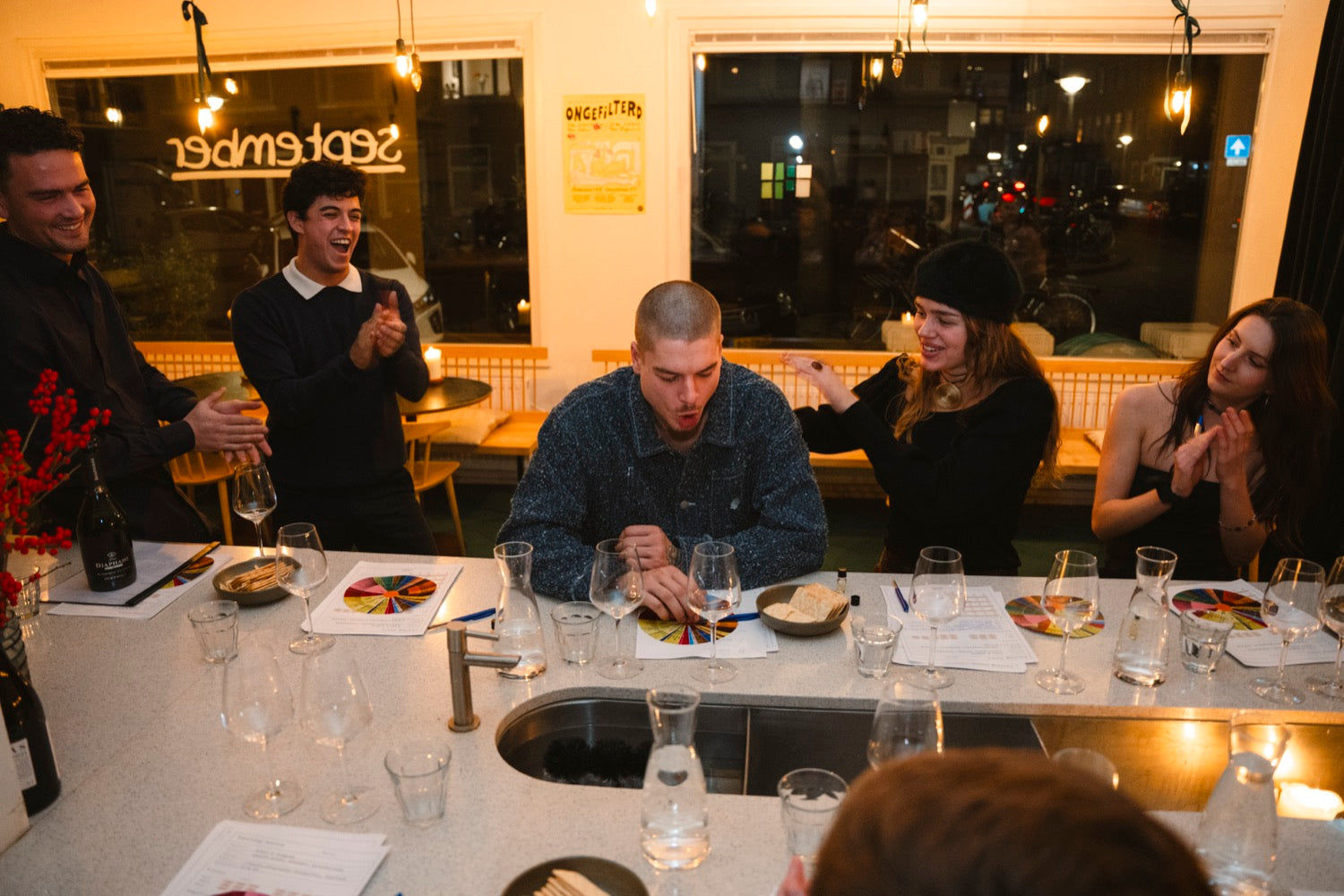 Guests gathered around the wine at a private tasting